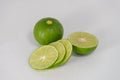 Fresh ripe green limes with sliced on white canvas background Royalty Free Stock Photo