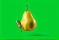 Fresh ripe green pear with leaves falling in the air, isolated on green background