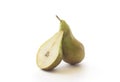 Fresh ripe green pear with sliced half of pear, isolated. Royalty Free Stock Photo