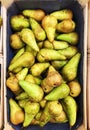 Fresh ripe green pears in box on the market Royalty Free Stock Photo