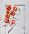 Fresh ripe hairloom tomatoes and basil on rustuc