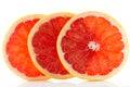 A fresh ripe juicy and appetizing grapefruit and its parts close-up, isolated on a white background.. Royalty Free Stock Photo