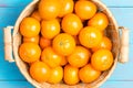 Fresh ripe juicy clementines in a wicker basket