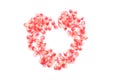 fresh ripe juicy grains Pomegranate, (Punica granatum) seeds arranged heart shape isolated a white backdrop