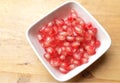 fresh ripe juicy grains Pomegranate, (Punica granatum) seeds in the square bowl