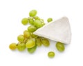 Fresh ripe juicy grapes with brie cheese on white background