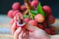 fresh ripe lychee fruit tropical fruit peeled lychees slice in Thailand, lychees on hand Royalty Free Stock Photo