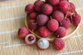 fresh ripe lychee fruit tropical fruit peeled lychees slice in Thailand, lychees on wooden plate Royalty Free Stock Photo