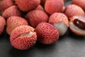 Fresh ripe lychee fruits on black table, closeup Royalty Free Stock Photo