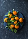 Fresh ripe mandarins on blue background, top view. Free space Royalty Free Stock Photo