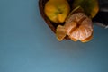 Fresh ripe mandarins isolated on blue background Royalty Free Stock Photo