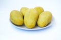 Fresh ripe mangoes on white plate Royalty Free Stock Photo