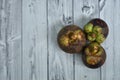 Fresh ripe mangosteen fruits on wooden table Royalty Free Stock Photo