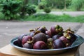 Fresh ripe mangosteen fruits on wooden table selectable focus Royalty Free Stock Photo