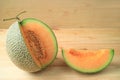 Fresh ripe muskmelon sliced from the whole fruit