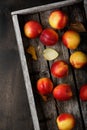 Fresh ripe nectarine in a box on a wooden table Royalty Free Stock Photo