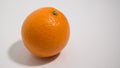 Fresh ripe orange on white background. Side view with space to right Royalty Free Stock Photo