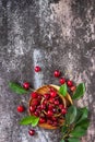 Fresh ripe organic berry. Red sweet cherry on plate on a dark stone tabletop. Top view flat lay background. Copy space. Royalty Free Stock Photo