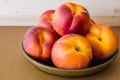Fresh ripe organic peaches close up on a plate
