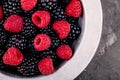 Fresh ripe organic raspberries and blackberries in a bowl closeup Royalty Free Stock Photo