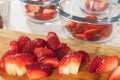 Fresh Ripe Organic Strawberry Sliced on a Wooden Chopping Board Royalty Free Stock Photo