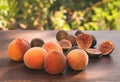 Harvest fresh ripe peaches and figs on an wooden table Royalty Free Stock Photo