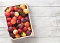 Fresh ripe peaches and plums Royalty Free Stock Photo