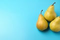 Fresh ripe pears on pale light blue background