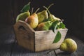 Fresh Ripe Pears In A Wooden Crate On Table.
