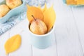 Fresh ripe pears and yellow autumn leaves on a white background. Copy space Royalty Free Stock Photo