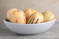 Fresh ripe pepino melons in bowl on grey table