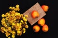 Fresh ripe persimmon on a black background . Persimmons fruit, Ripe sweet persimmons Royalty Free Stock Photo