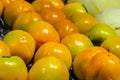 Fresh ripe persimmons placed on table in market Royalty Free Stock Photo