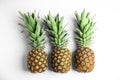 Fresh ripe pineapples on white background, flat lay Royalty Free Stock Photo