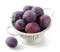 Fresh ripe plums in colander Royalty Free Stock Photo