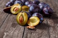 Fresh plums over wooden table background Royalty Free Stock Photo