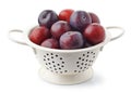 Fresh ripe plums in white colander Royalty Free Stock Photo