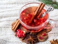 Fresh ripe pomegranate and red wine in a glass mug on a white knitted blanket Royalty Free Stock Photo