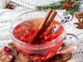 Fresh ripe pomegranate and red wine in a glass mug on a white knitted blanket Royalty Free Stock Photo