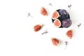 Fresh ripe purple figs composition. Food Photo. Sliced and whole exotic fruit in vintage bowl. Limonium flowers on a