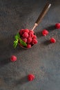 Fresh ripe raspberries in a cup on dark background. Top view, copy space. Natural cosmetics. Summer background, greeting card, Royalty Free Stock Photo