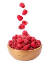 Fresh ripe raspberries falling into bowl on white background Royalty Free Stock Photo