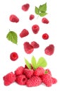 Fresh ripe raspberries with green leaves falling on background Royalty Free Stock Photo