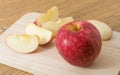 Fresh ripe red apple on a wooden cutting board Royalty Free Stock Photo