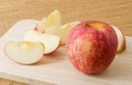 Fresh Ripe Red Apple on Wooden Cutting Board Royalty Free Stock Photo