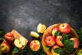 Fresh ripe red apples in the basket at white table. Royalty Free Stock Photo