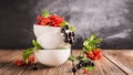 Fresh ripe red black currant berry in white bowls stand in a pile on the table. Selective focus. Horizontal frame. Royalty Free Stock Photo