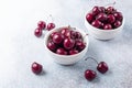 Fresh ripe red cherries in a white bowl on a gray stone background Closeup Royalty Free Stock Photo
