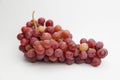 Fresh and ripe red grapes isolated in white background. Bunch of raw and juicy grapevines Royalty Free Stock Photo