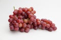 Fresh and ripe red grapes isolated in white background. Bunch of raw and juicy grapevines Royalty Free Stock Photo